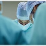 doctors and nurse doing surgery